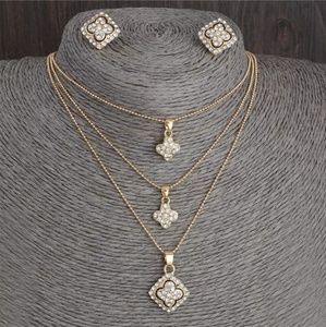 3 necklaces and a pair of matching earrings